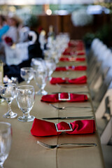 Elegant red place-settings for wedding dinner