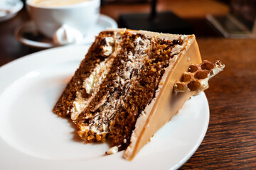 slice of honey and white chocolate torte on a white plate