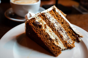 slice of honey and white chocolate torte on a white plate