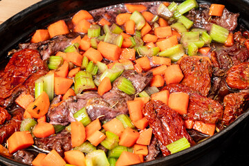 making of beef cheeks sauteed in rich wine rosemary and vegetable gravy