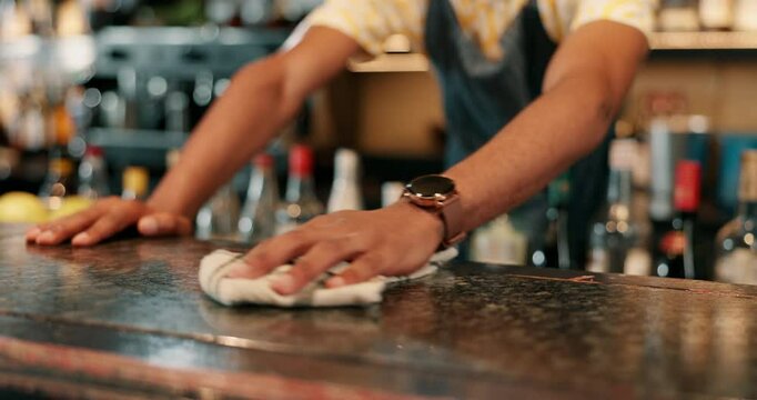 Hands, bar and hygiene for table, cleaning and bartender with cloth for bacteria, disinfection and person. Business, employee and wiping of counter for dirt, hospitality and prevention of germs