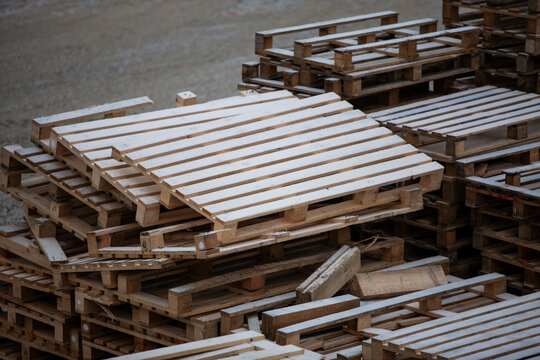 Pile of wooden pallets at a construction site