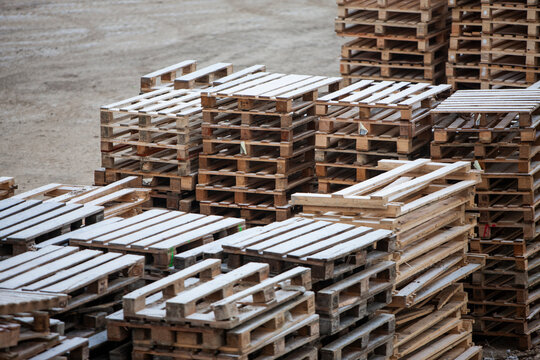 Pile of wooden pallets at a construction site