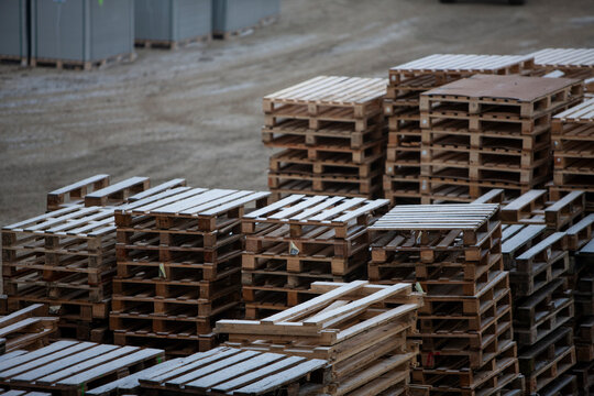 Pile of wooden pallets at a construction site