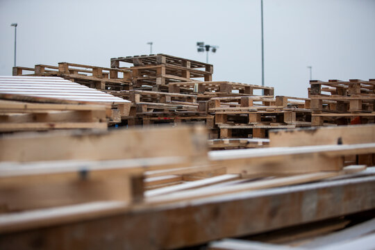 Pile of wooden pallets at a construction site