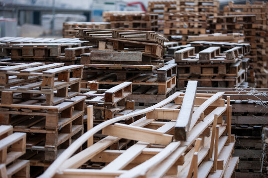 Pile of wooden pallets at a construction site