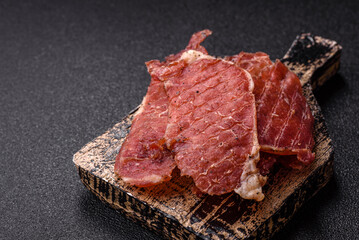 Jerky, dried pork meat slices with salt and spices