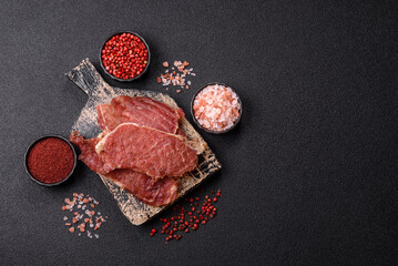 Jerky, dried pork meat slices with salt and spices