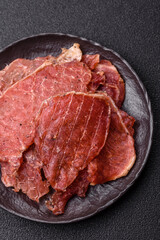 Jerky, dried pork meat slices with salt and spices