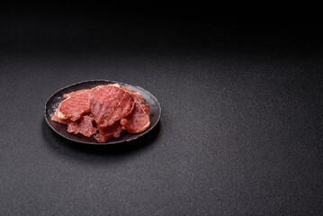 Jerky, dried pork meat slices with salt and spices