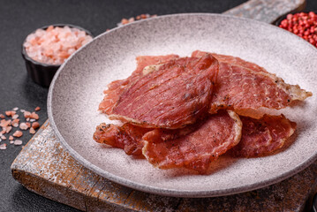 Jerky, dried pork meat slices with salt and spices