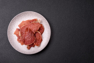 Jerky, dried pork meat slices with salt and spices