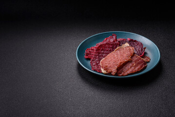 Jerky, dried pork meat slices with salt and spices