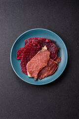 Jerky, dried pork meat slices with salt and spices