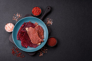 Jerky, dried pork meat slices with salt and spices