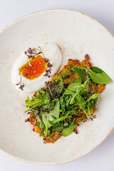 Delicate Garden Herb Fritter Garnished With Fresh Greens and a Tangy Lemon Cream, Celebrating the Freshness of Spring.