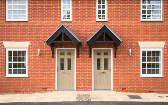 Front door of new build homes, housing development, UK
