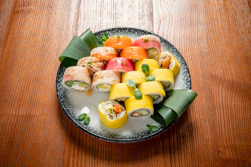 Colorful Sushi Platter Showcasing a Variety of Rolls Artfully Arranged on a Wooden Table, Enticing Flavors and Textures Delight the Senses During a Gourmet Dining Experience.