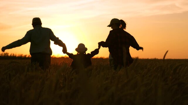 happy family running wheat field. family farm. father mother child kid girl running wheat field sunset. happy family life concept. woman man husband wife child daughter running farm. agriculture