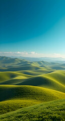 Obraz premium Vibrant Green Hills Under a Clear Blue Sky Wallpaper
