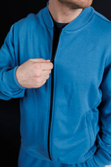 This is a Stylish Blue Athletic Jacket that features a convenient Zipper for easy wear