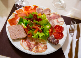 Traditional Catalan salad with sausage and ham