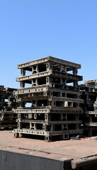 Metal parts of the stage are stacked on top of each other. with white shades