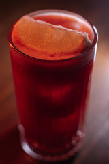 A beautiful bright cocktail. Restaurant, a glass with a drink is on the table