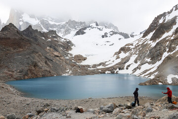 Two travelers interacting at Laguna de Los Tres