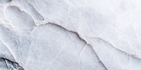 Obraz premium Textured white marble surface with natural veining patterns