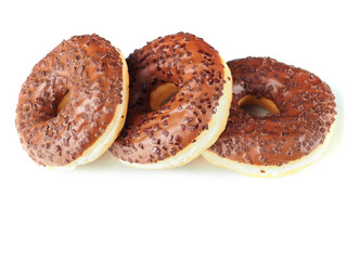Three chocolate donut with sprinkles on top. The donut is sitting on a white background. Premium...