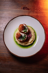 Delicious cutlets with airy mashed potatoes served in the restaurant. The perfect photo for a menu, culinary blog, or an advertisement for catering establishments.