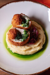 Delicious cutlets with airy mashed potatoes served in the restaurant. The perfect photo for a menu, culinary blog, or an advertisement for catering establishments.
