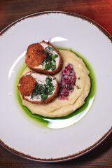 Delicious cutlets with airy mashed potatoes served in the restaurant. The perfect photo for a menu, culinary blog, or an advertisement for catering establishments.