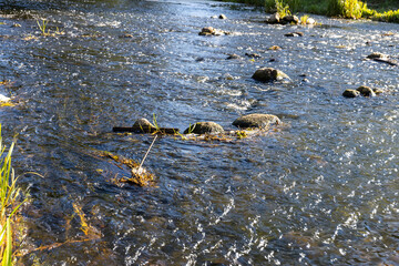 a wide but shallow river with a large current