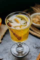 Aromatic spiced tea with orange and cinnamon in an elegant glass, creating a cozy and warm ambiance