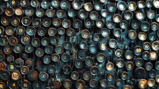 A surface densely covered with vintage typewriter keys, filling every inch of the frame with their mechanical texture and retro aesthetic.