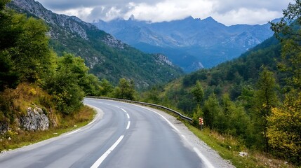 Scenic winding road through the green mountains under a cloudy sky : Generative AI