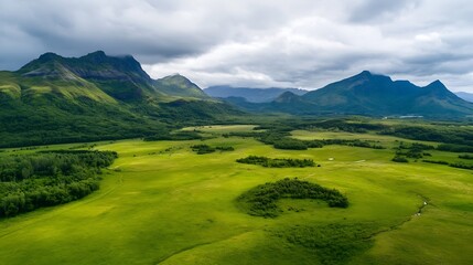 Obraz premium Breathtaking Aerial View of Lush Green Countryside with Rolling Mountains : Generative AI