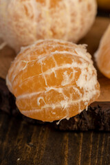 peeled orange ripe tangerines on the table