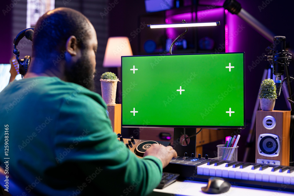 Aufkleber young audio engineer mixing tunes on console and piano keys with an isolated screen, home studio equ