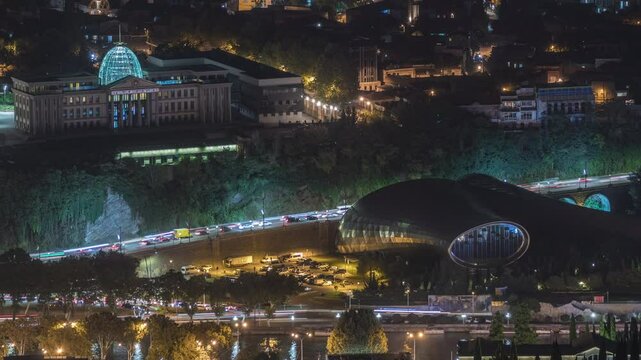 The Ceremonial Palace of Georgia and concert hall aerial night timelapse. A palace for state ceremonies, located on the left bank of the Kura River, in the Avlabari district of Tbilisi, Georgia.