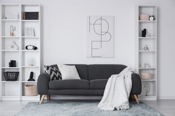 Stylish interior in black and white colors with modern sofa