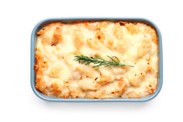 Baking dish with tasty pasta, cheese and rosemary on white background