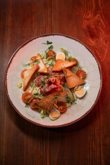 Caesar salad with bacon is mouthwatering and delicious. A beautiful perfect photo for a cafe or restaurant menu, advertisement, culinary website. Suitable for design