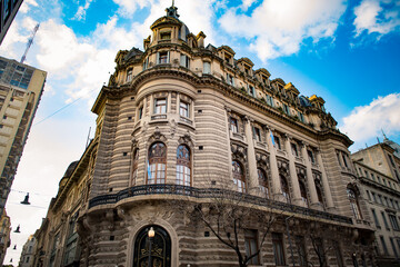 Iconic historic building in Buenos Aires, Argentina, set against a clear blue sky, showcasing intricate architectural details.