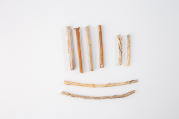 Collection of wooden sticks arranged on white background. step in creative process, material...