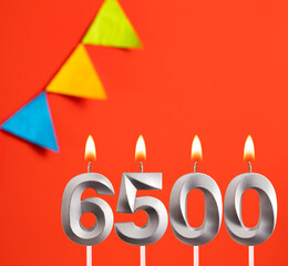 Candle number 6500 - Number of followers or likes.