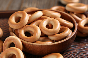 Bowl of tasty bagels, closeup