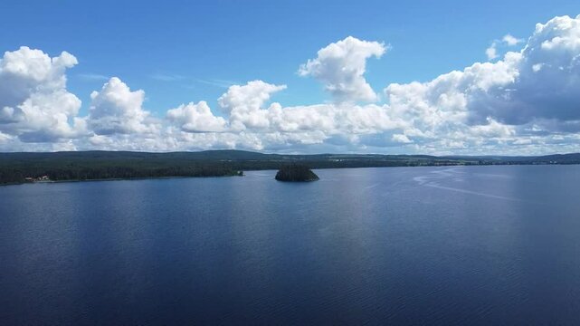 Panoramic aerial view of the blue coat of Lake Matapedia under a cloudy sky, Amqui, Matapedia Valley.
